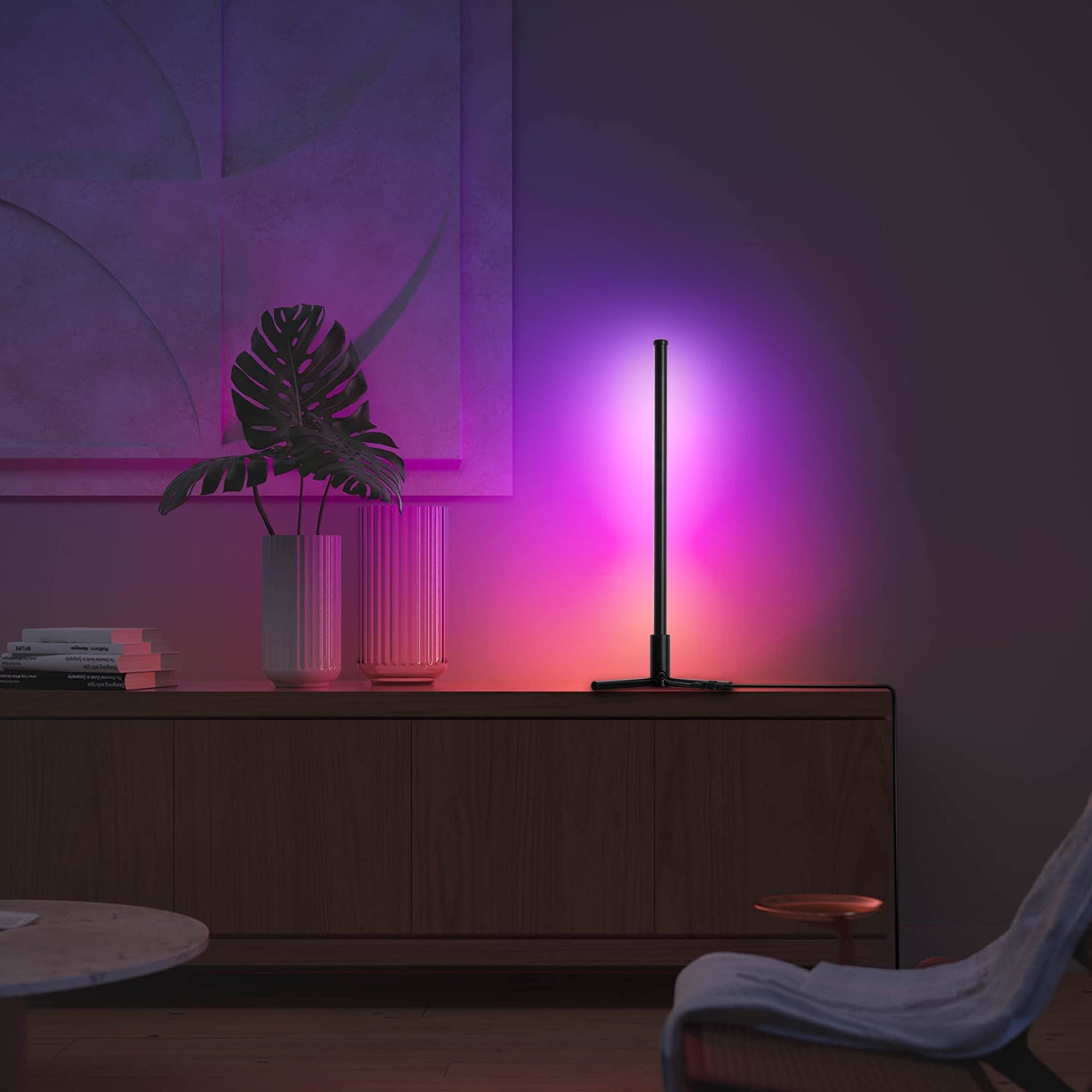 RGBCW Corner Table Lamp - Black glowing with adjustable color temperature in a modern living room corner.