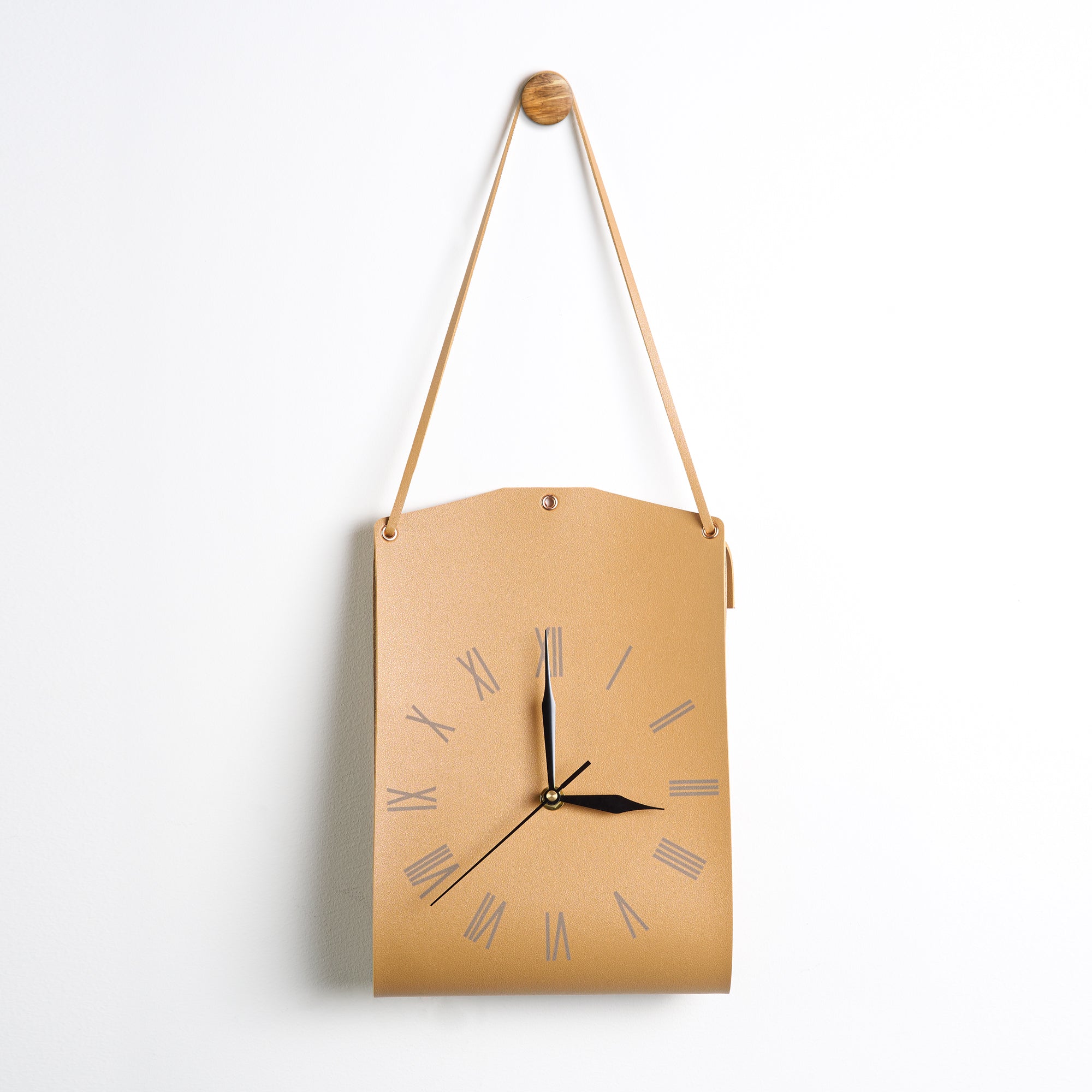 Roman Numerals Leather Wall Clock with sleek leather design and silent timekeeping, perfect for modern décor.