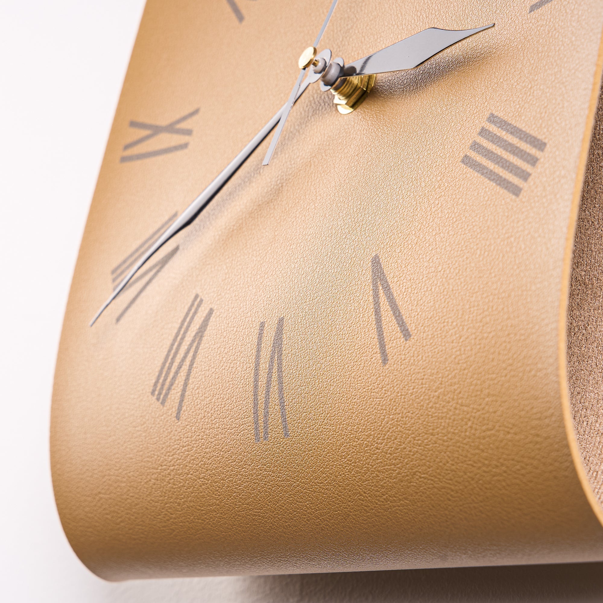Roman Numerals Leather Wall Clock with sleek brown leather texture and silent silver hands for modern wall décor.