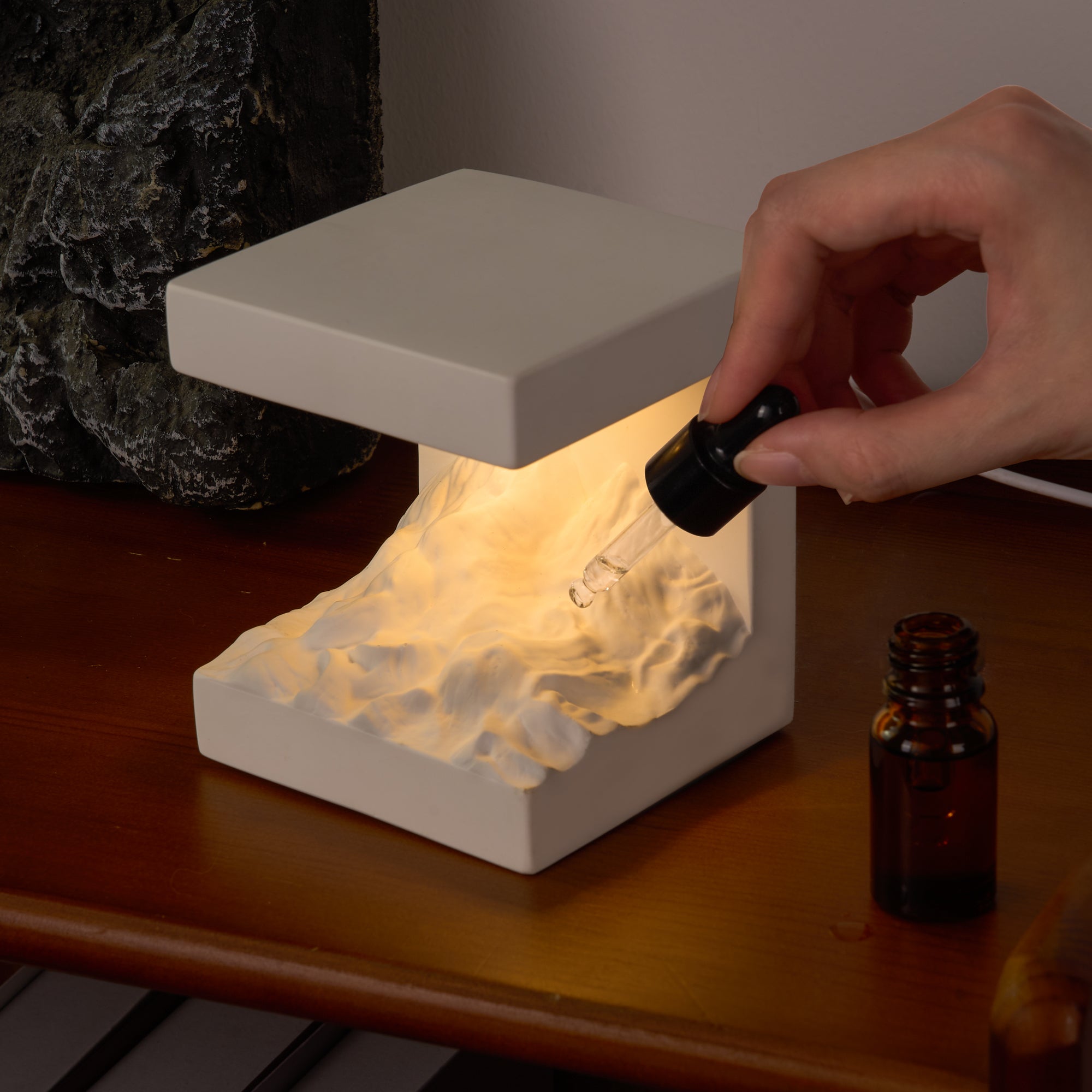 Snow Mountain Night Light & Diffuser Stone with adjustable warm glow and essential oil diffuser for calming ambiance.