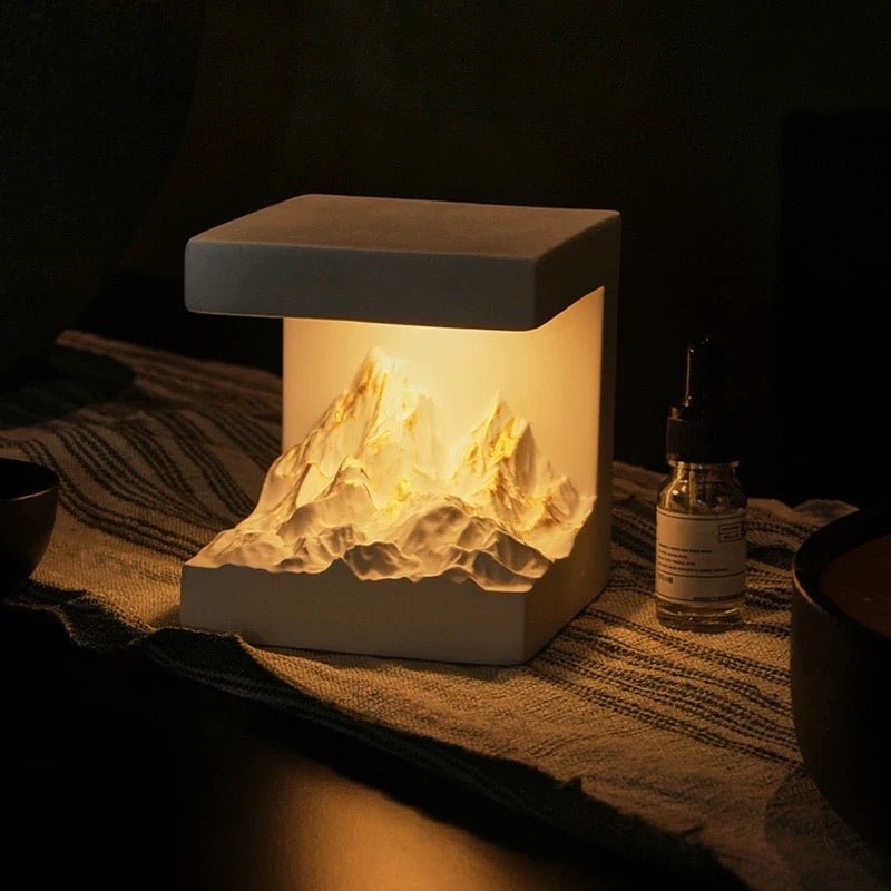 Snow Mountain Night Light & Diffuser Stone creating a warm, serene mountain glow with adjustable light and aromatherapy.