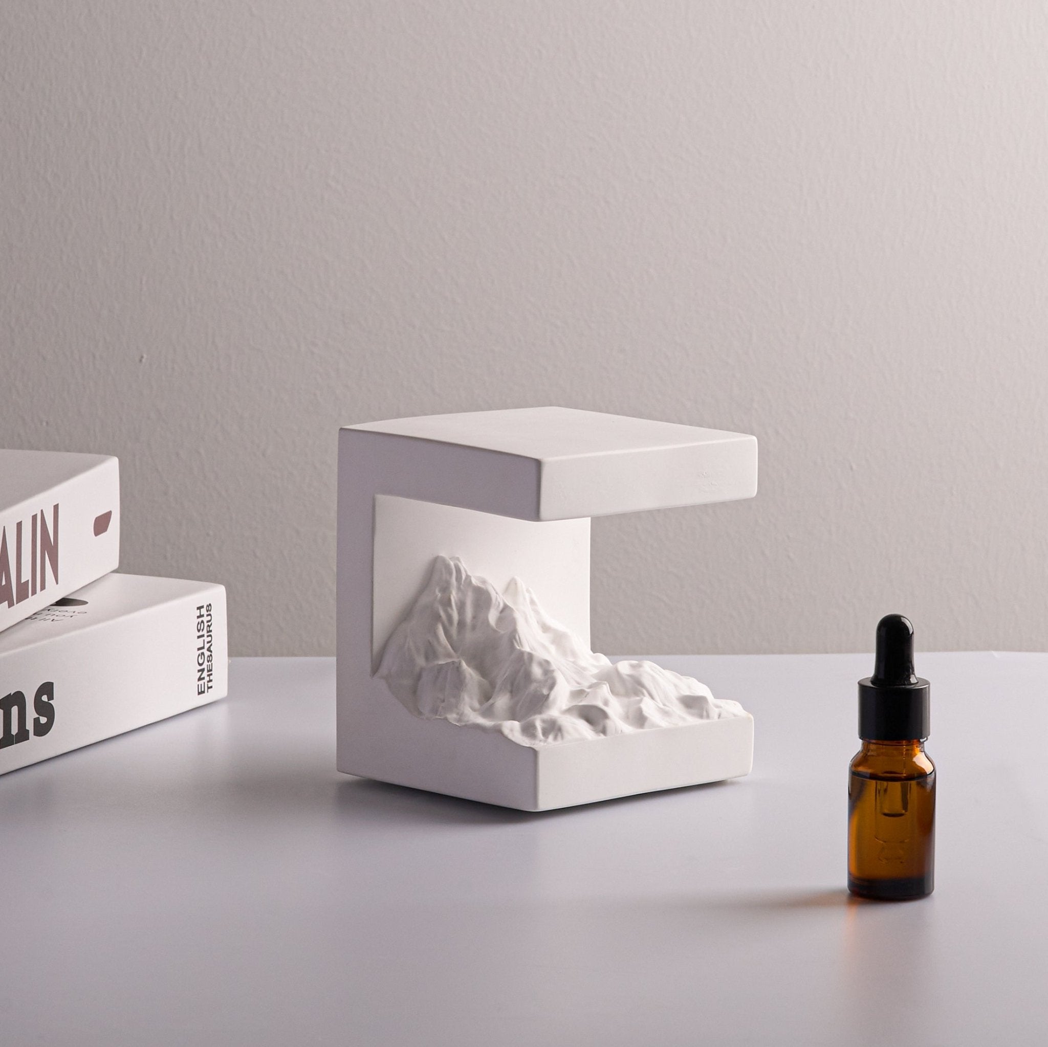 Snow Mountain Night Light & Diffuser Stone gypsum lamp with sculpted mountain design and essential oil diffuser.