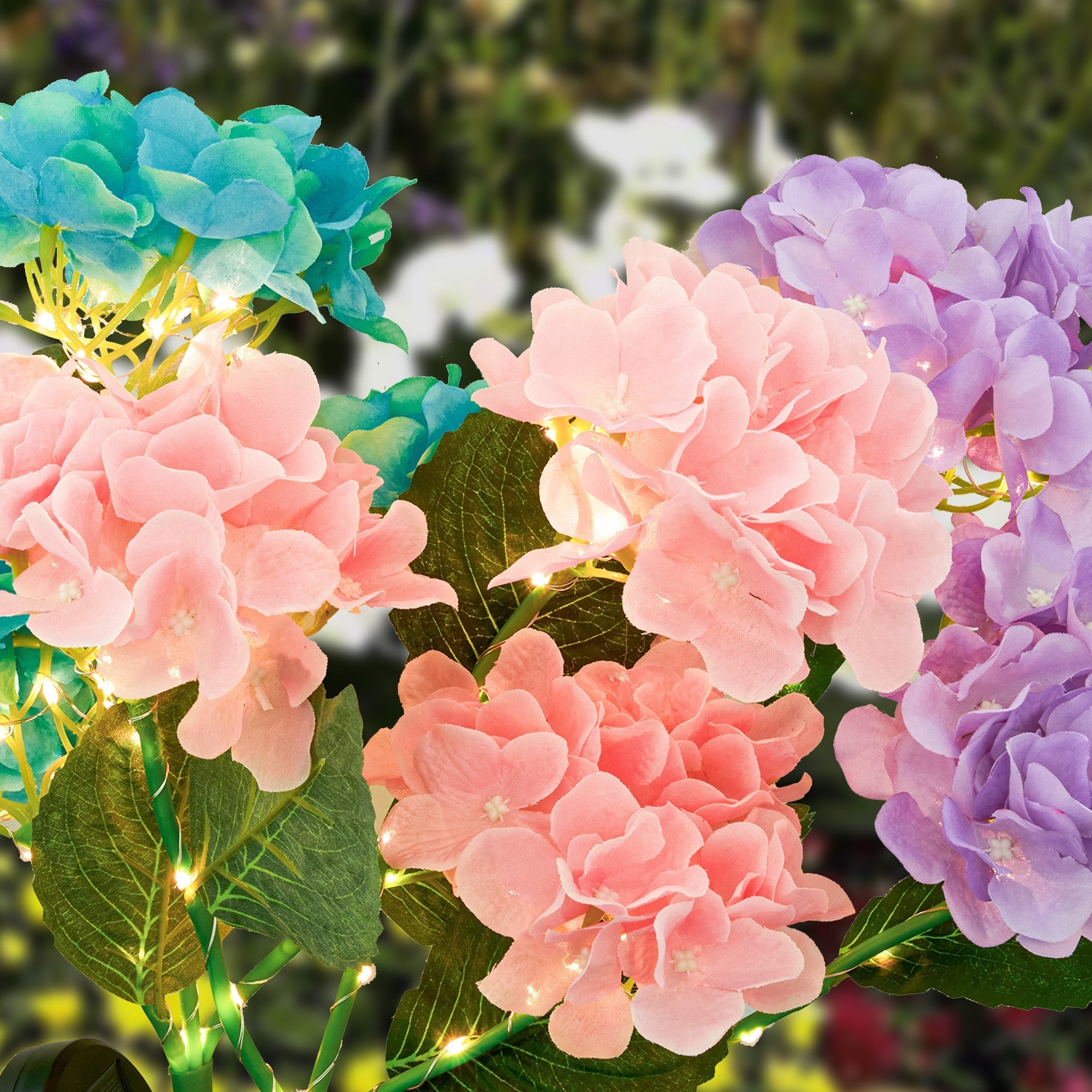 Solar Powered Hydrangea Pathway Light with vibrant pink, purple, and blue flower design illuminating garden pathways.