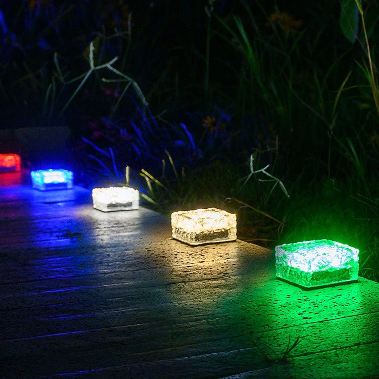 Solar Powered Ice Bricks Path Lights, 6 Pack illuminating a garden walkway with colorful, durable solar-powered ice brick design.