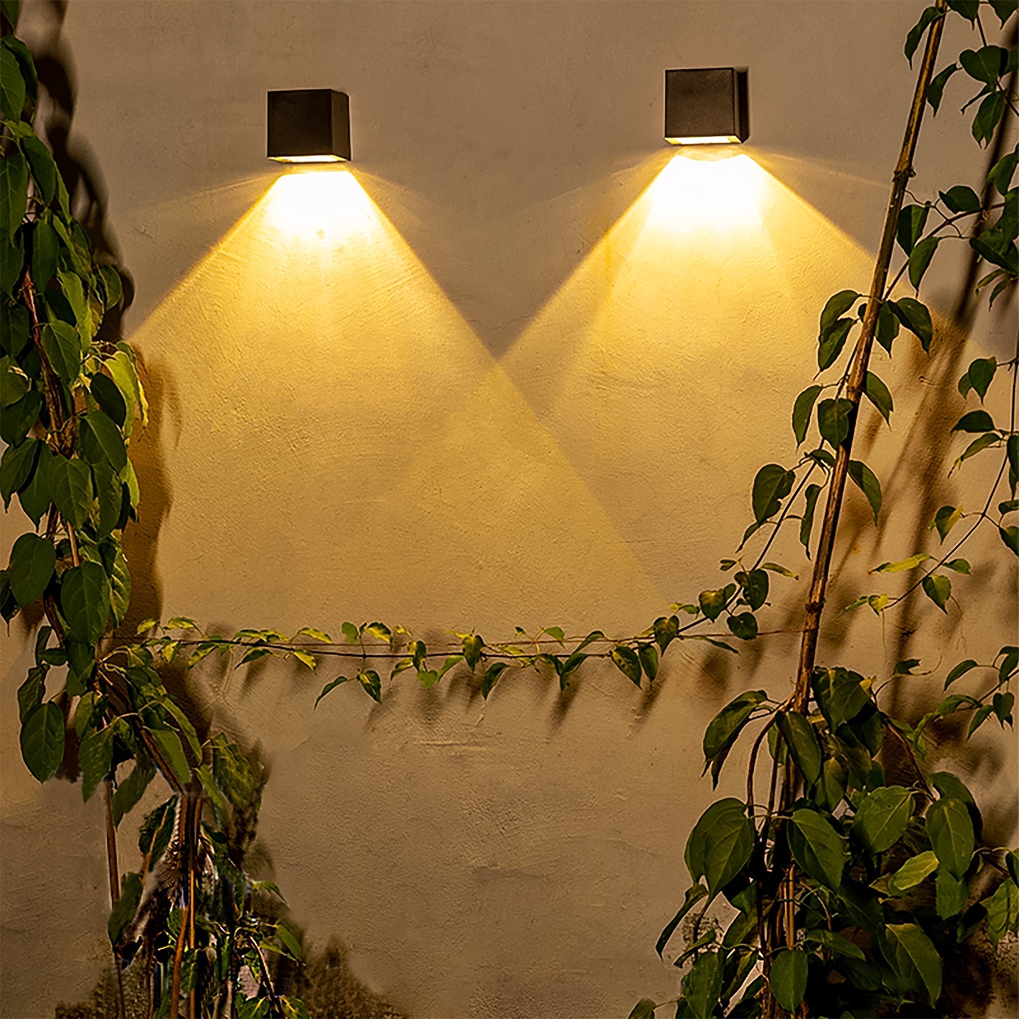 Solar Powered Outdoor Landscape Wall Lights illuminating a garden wall with warm, adjustable light, no wiring needed.
