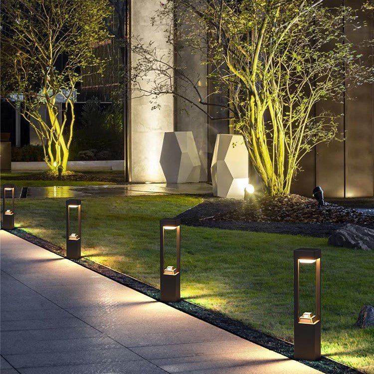 Solar Powered Outdoor Landscaping Path Lights illuminating a garden pathway with warm, eco-friendly lighting at dusk.