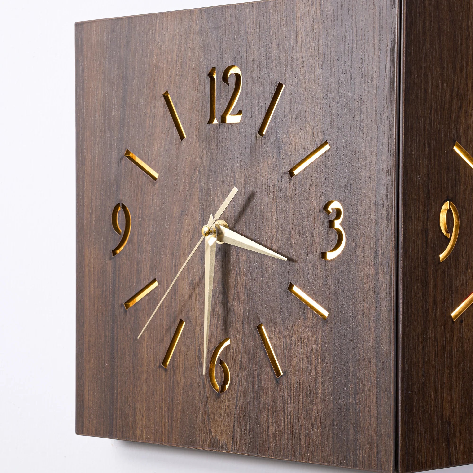 Sound and Darkness Activated Wall Corner Clock with sleek wooden design and silent, illuminated gold-tone numbers.