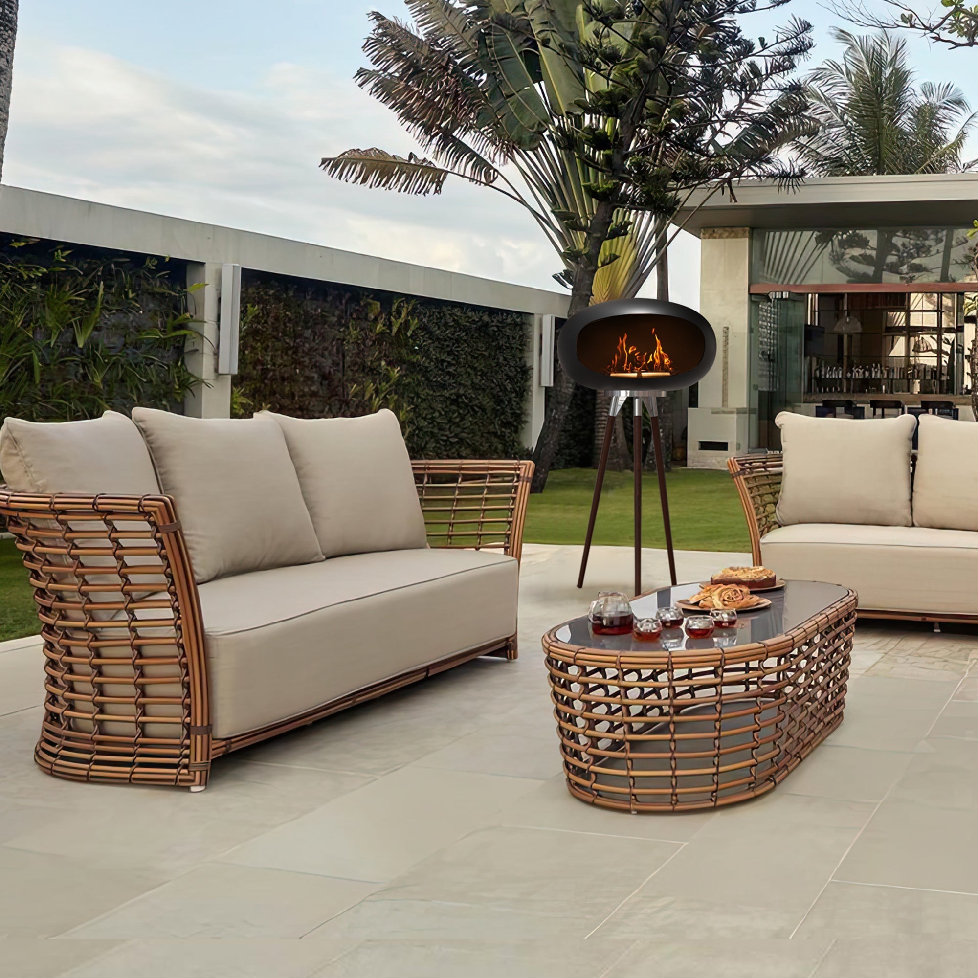 Tripod Indoor Outdoor Ethanol Fireplace with wooden tripod legs and metal dome warming a modern outdoor patio setup