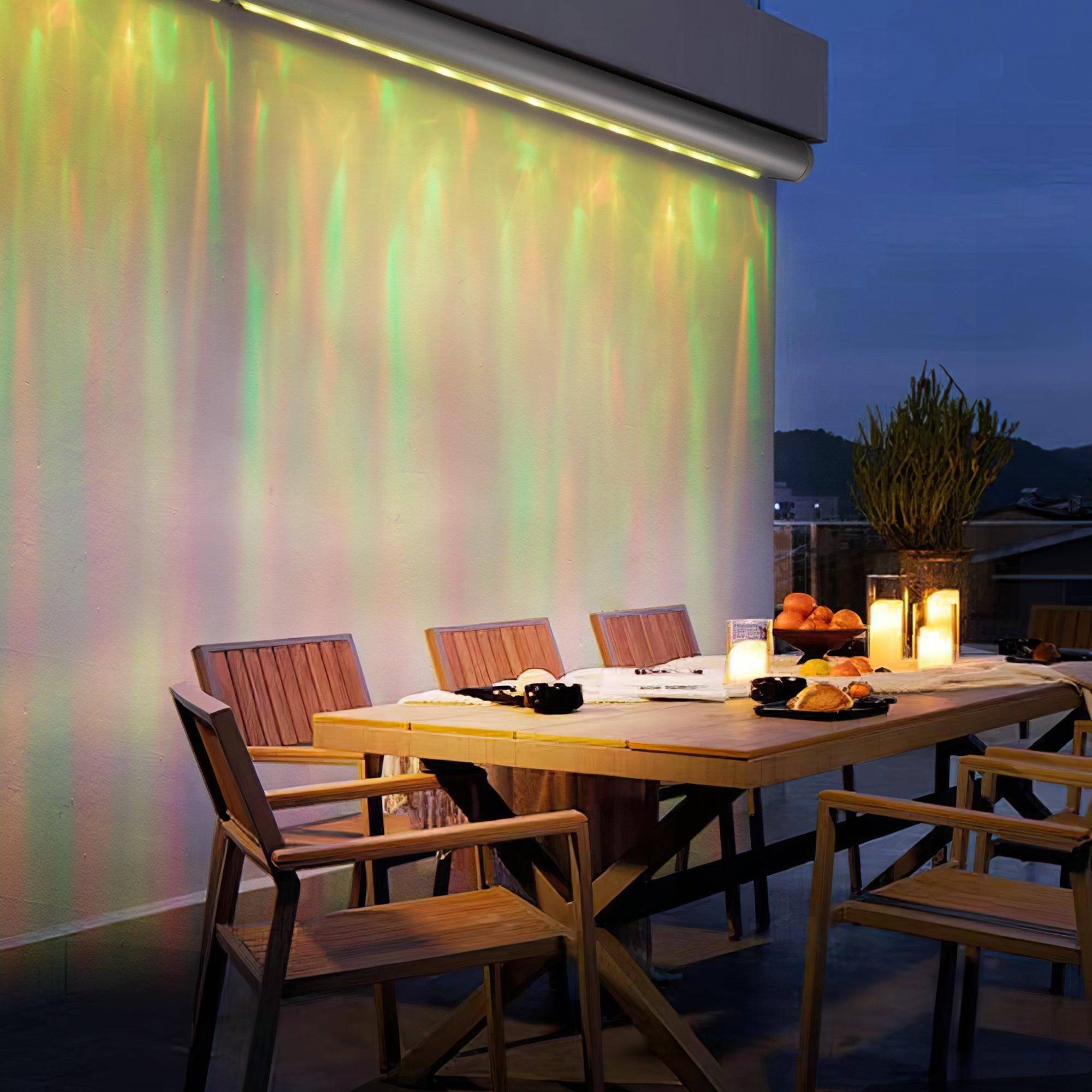 Waterproof Outdoor RGBW Ocean Wave Lights creating vibrant, colorful wave patterns on an outdoor patio wall at night.
