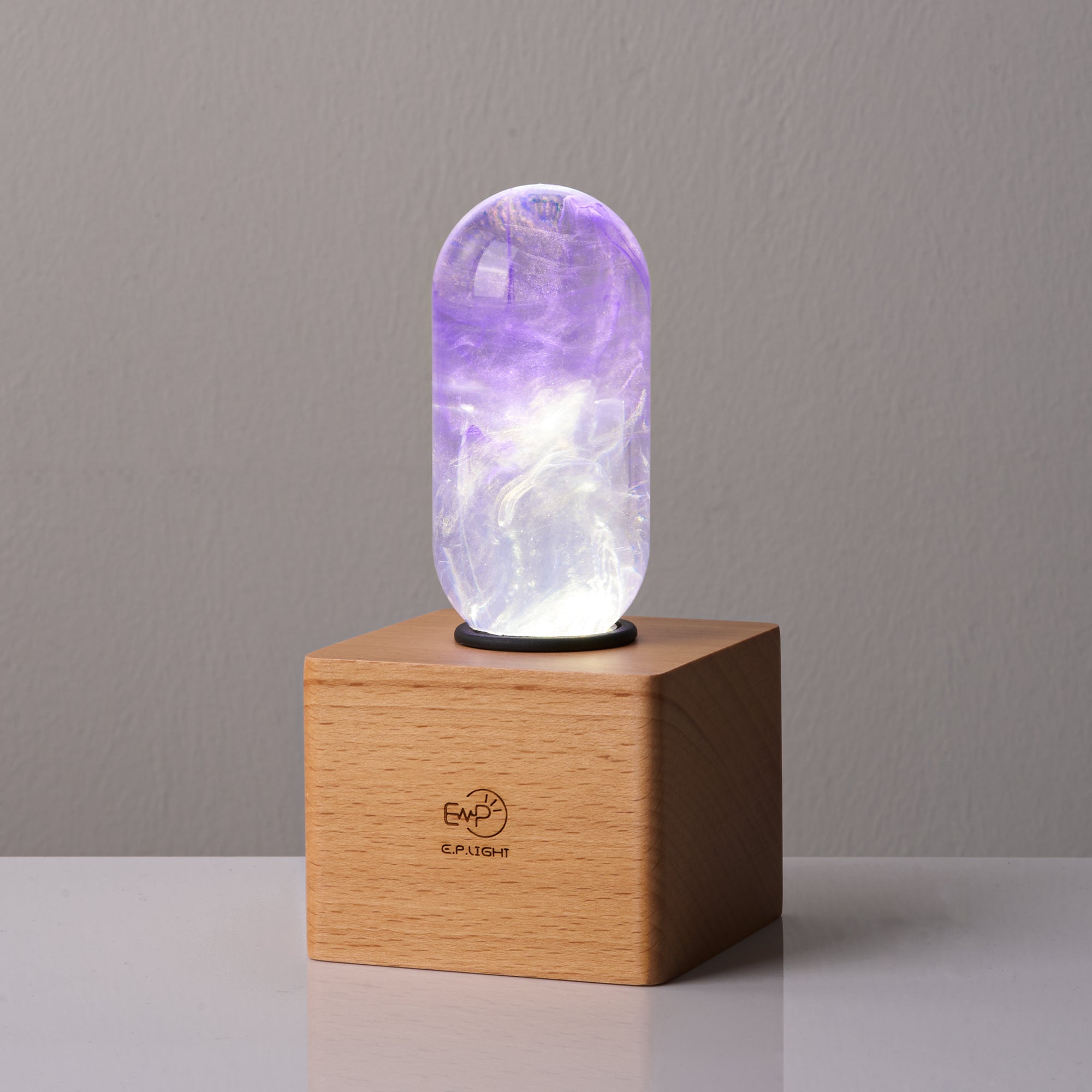 EP Light - Amethyst handcrafted eco-resin bulb with unique purple glow and elegant wooden base for vibrant, lasting illumination.