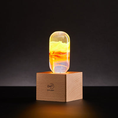 EP Light - Flame bulb glowing with fiery amber hues on a wooden base, handcrafted safe-to-touch LED decor.