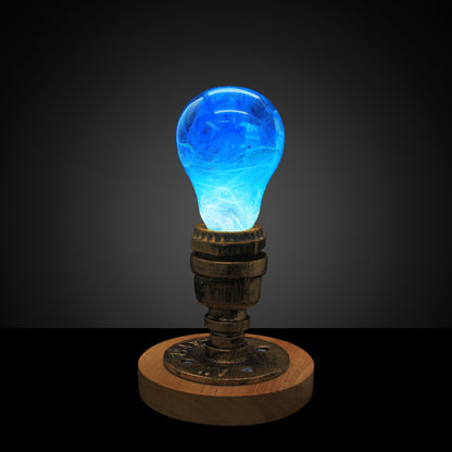 EP Light - Memory bulb glowing blue with unique swirl design on vintage wooden base, eco-friendly and handcrafted.