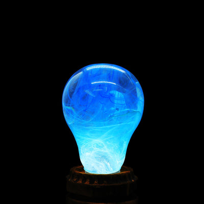 EP Light - Memory bulb glowing with unique blue swirl design on vintage wooden base, eco-friendly and energy-saving.