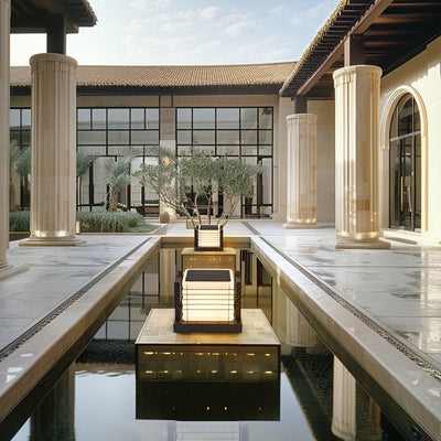 Outdoor Solar Fence Post Cap Lights illuminating modern outdoor water feature with elegant, solar-powered lighting.