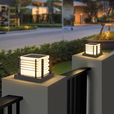 Outdoor Solar Fence Post Cap Lights illuminating modern fence posts with warm, energy-saving solar lighting.