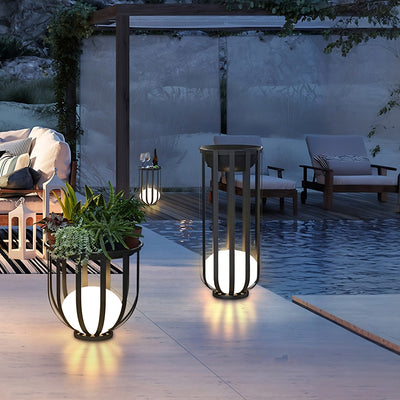 Outdoor Solar Power LED Plant Stand lighting up patio with elegant, wire-free solar-powered ambiance and plant display.