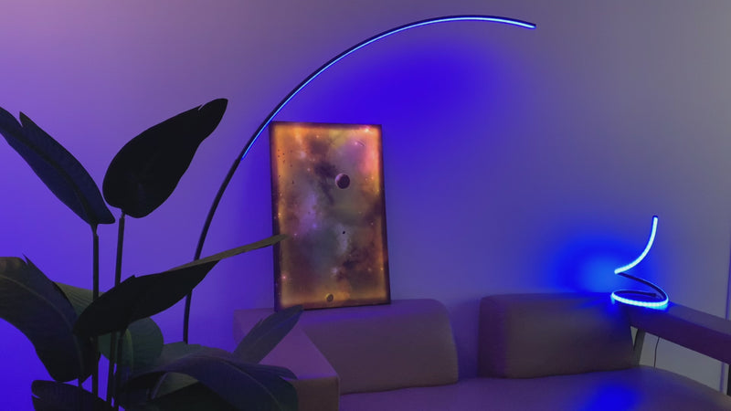 RGB LED floor lamp with over 1 million color options and remote control, featured in a modern minimalist home setting