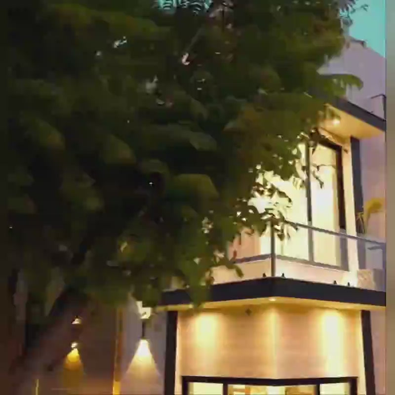 Load video: House with decorative LED lamp emitting soft ambient glow, placed as cozy lighting decor in a home interior setting